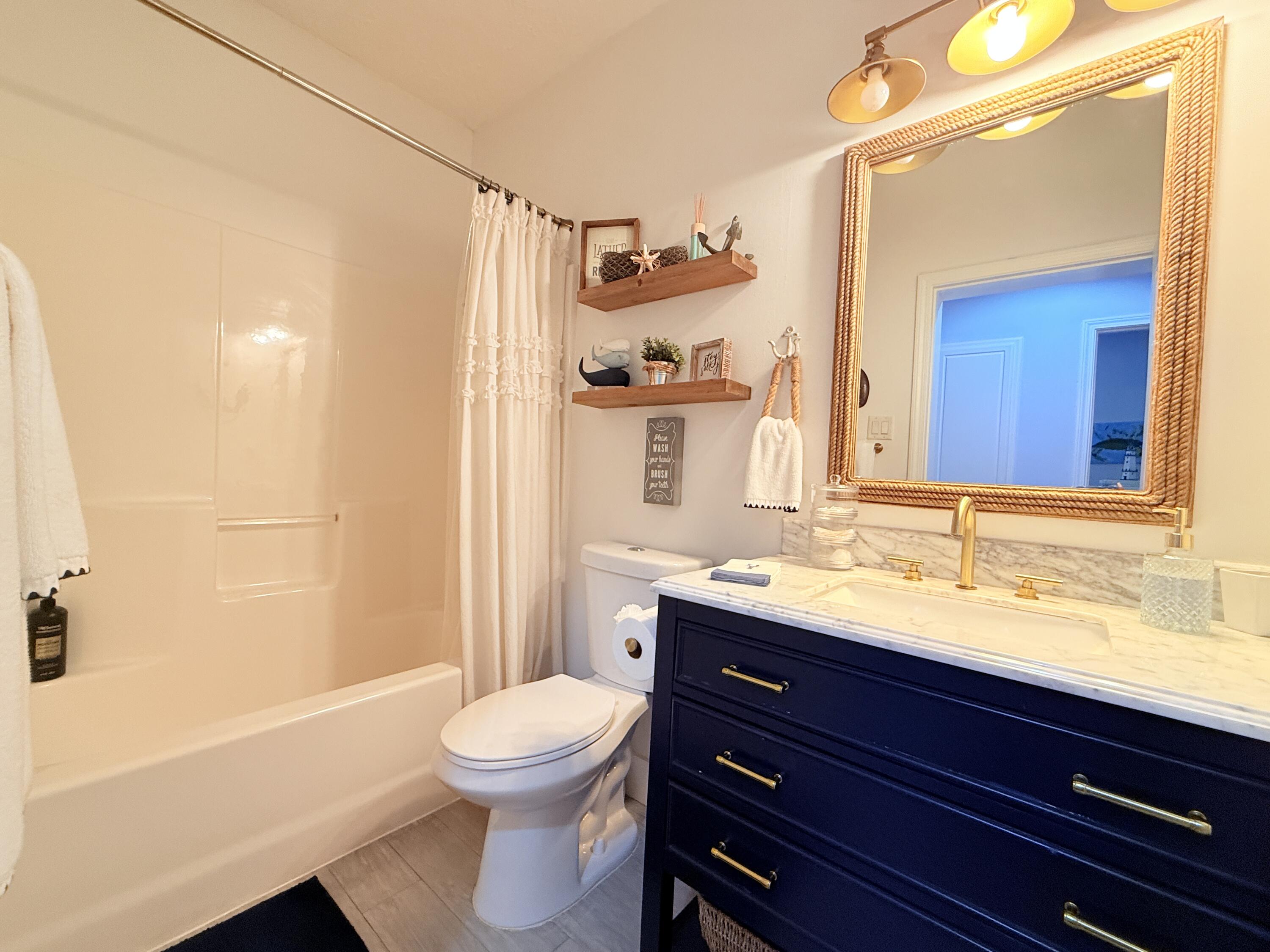 614 R Santa Anita Lane Key Largo, FL 33037 - Photo 32 of 64 a bathroom with a sink a toilet and shower