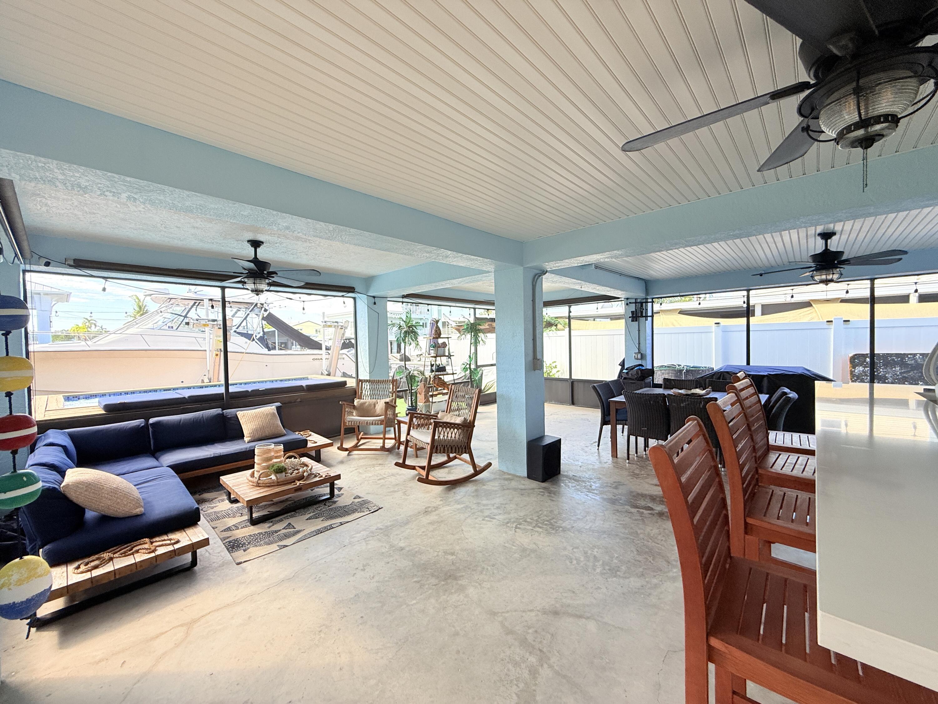 614 R Santa Anita Lane Key Largo, FL 33037 - Photo 43 of 64 a room with gym equipment and a large window