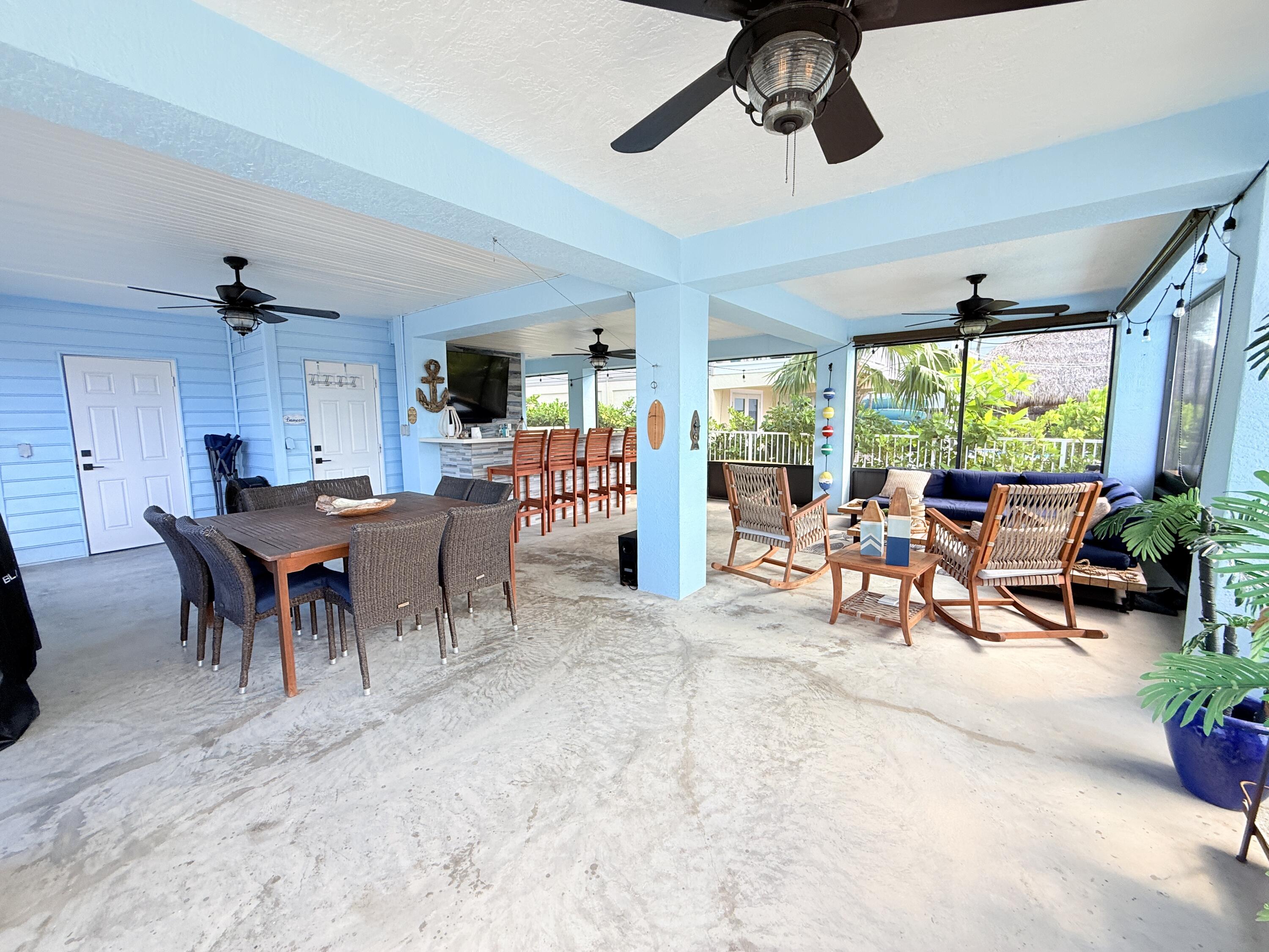 614 R Santa Anita Lane Key Largo, FL 33037 - Photo 44 of 64 a view of a dining room with furniture window and outside view