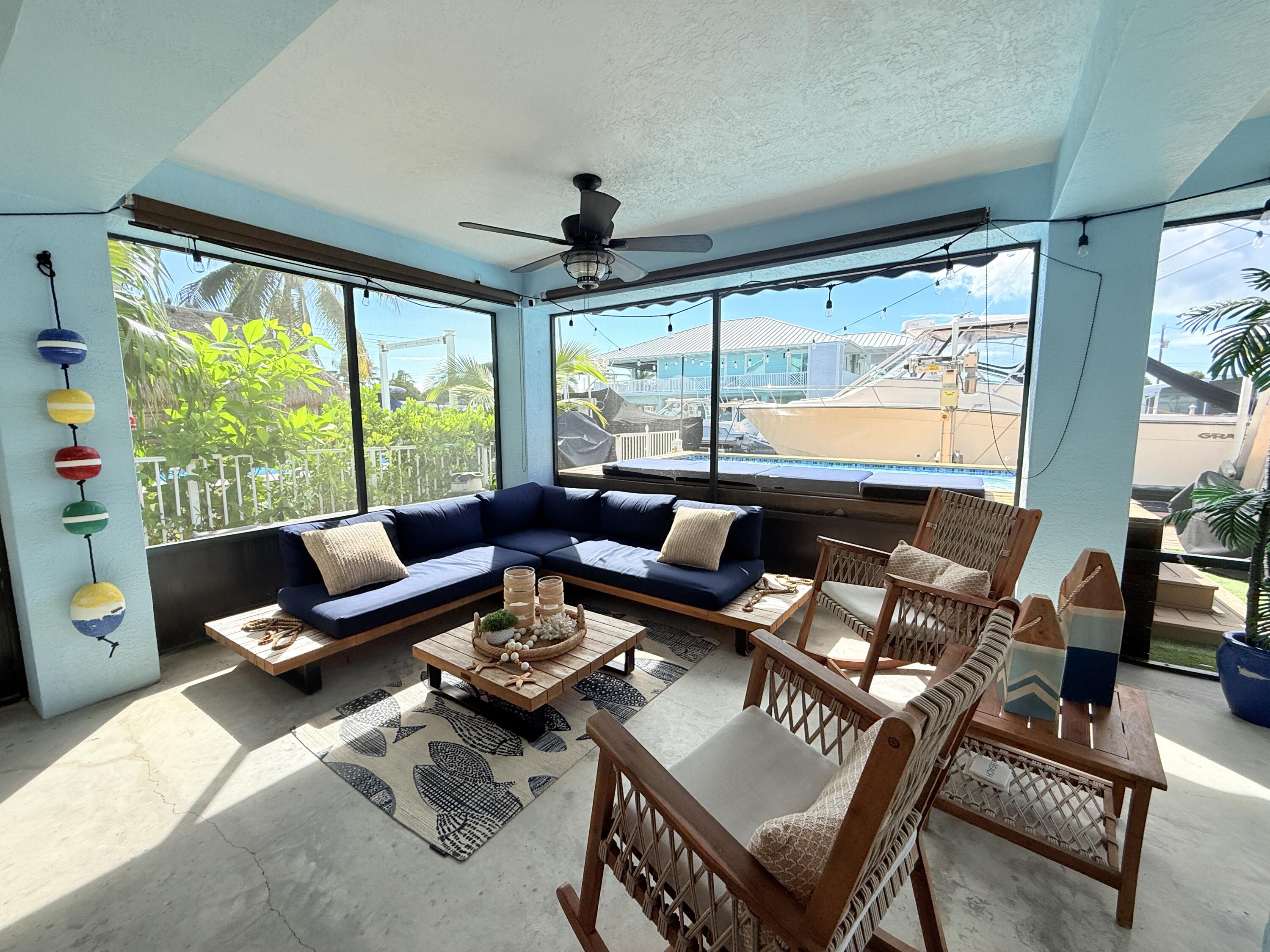 614 R Santa Anita Lane Key Largo, FL 33037 - Photo 45 of 64 a living room with furniture and a large window