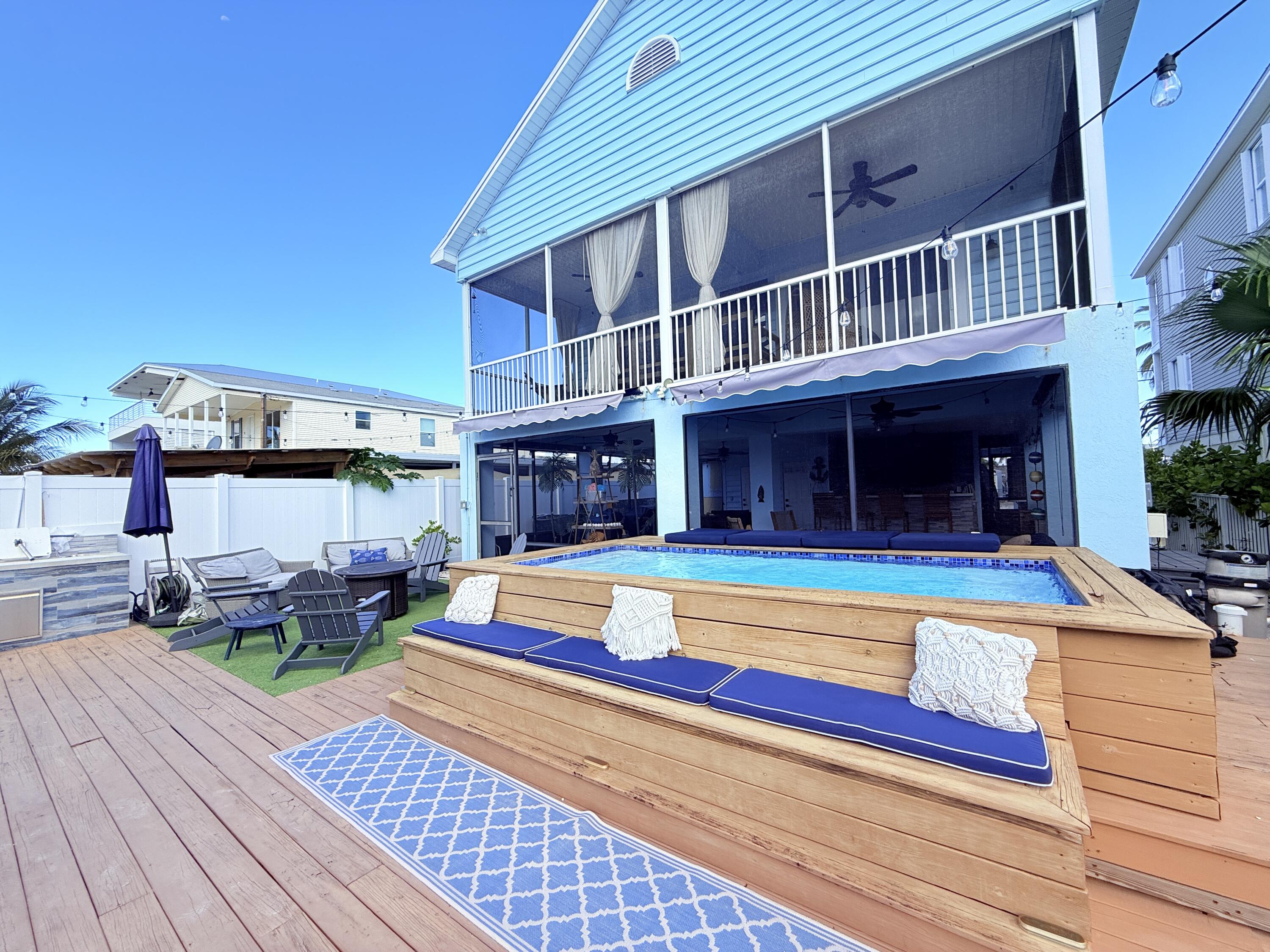 614 R Santa Anita Lane Key Largo, FL 33037 - Photo 51 of 64 a view of pool with lawn chairs and potted plants