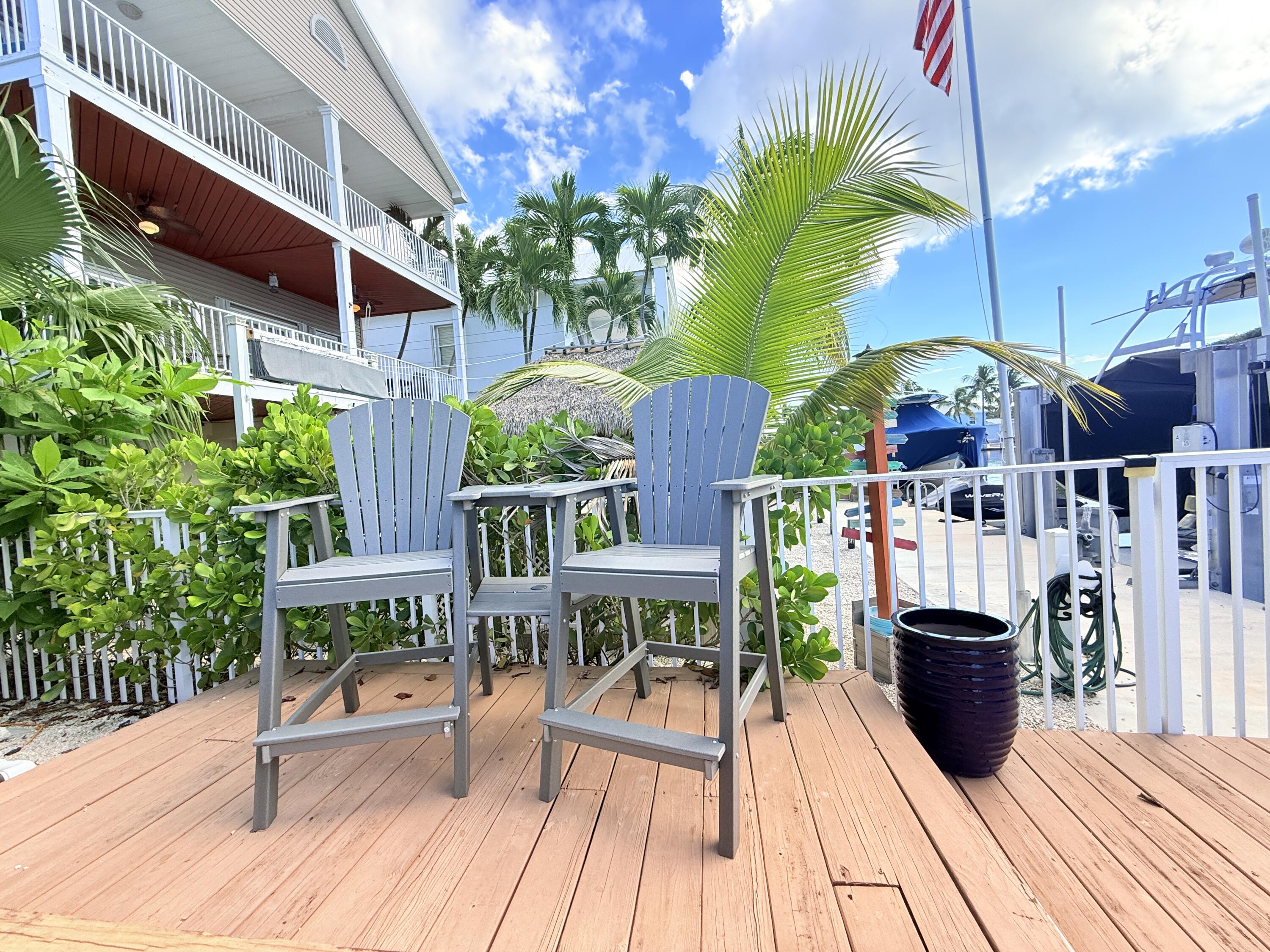 614 R Santa Anita Lane Key Largo, FL 33037 - Photo 59 of 64 a view of a chairs and table in the balcony