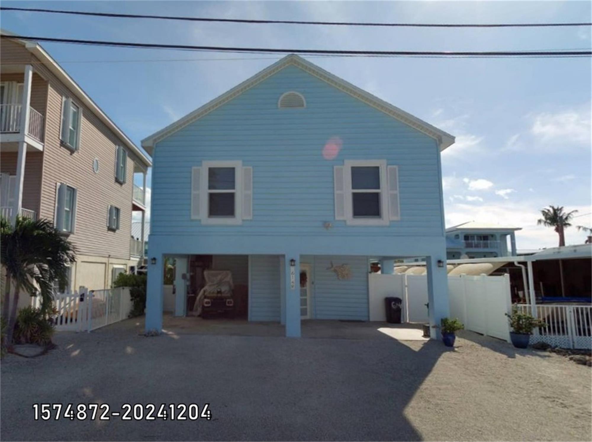 614 R Santa Anita Lane Key Largo, FL 33037 - Photo 61 of 64 a view of a house with a patio