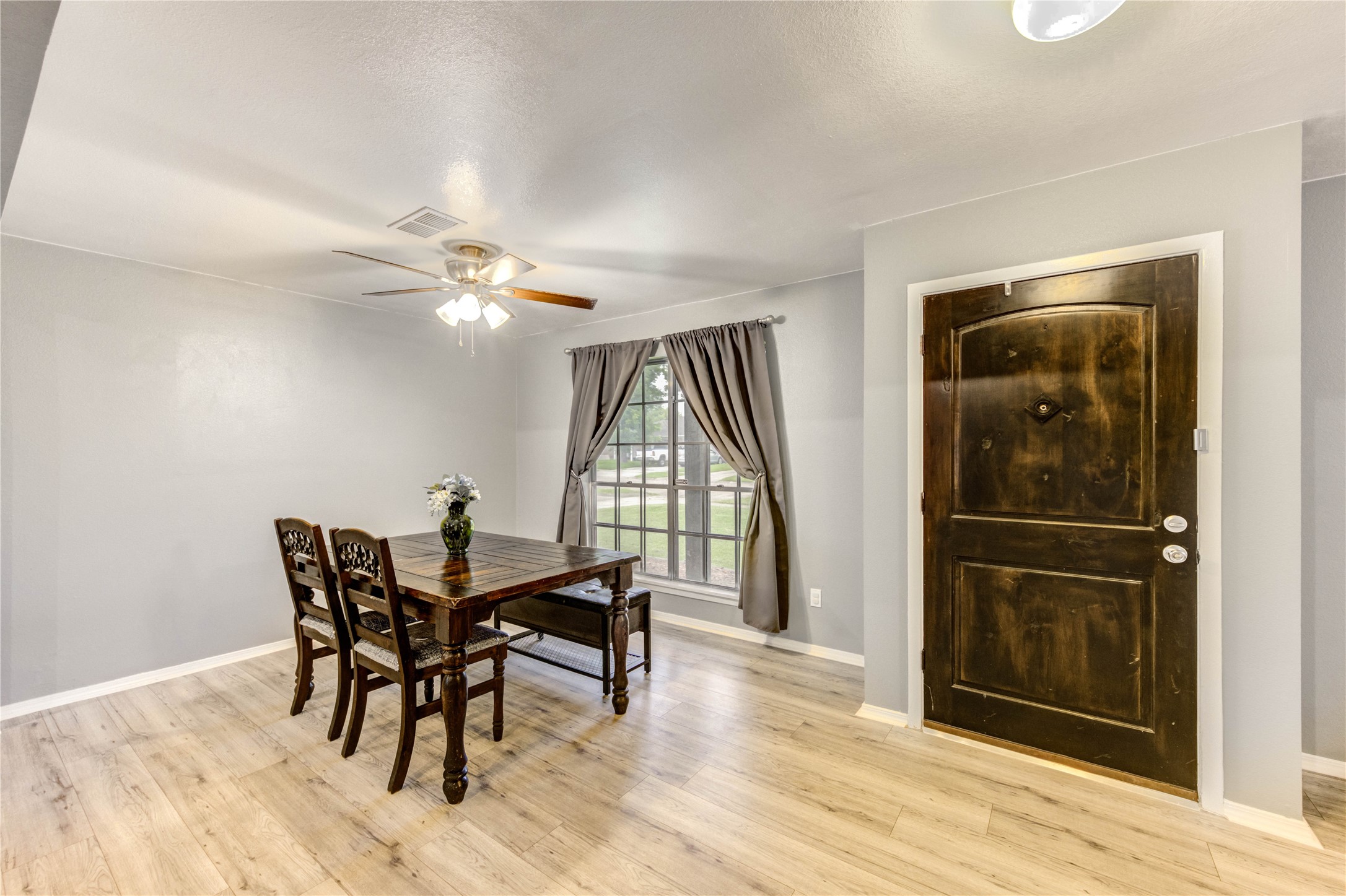 8510 Collingdale Road La Porte, TX 77571 - Photo 11 of 20 a view of a dining room with furniture and wooden floor