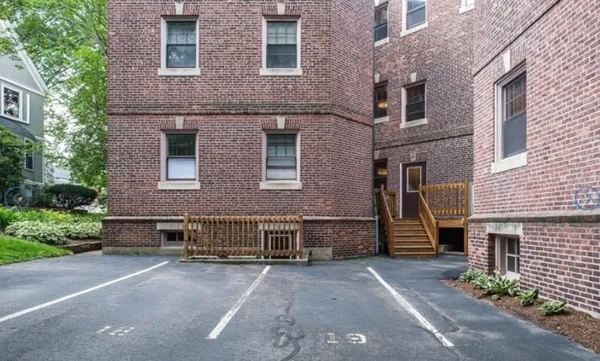 a front view of a house with a yard and a garage