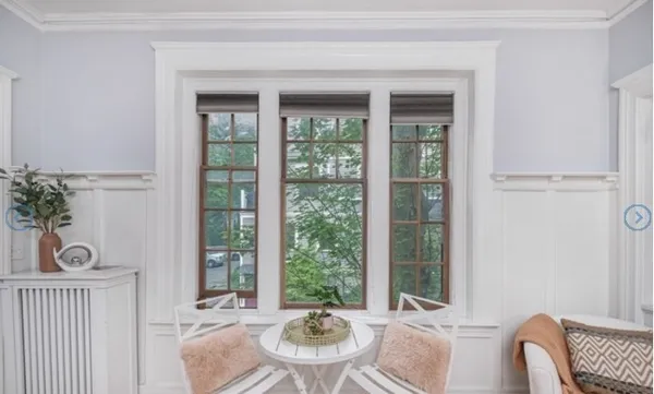 a view of a dining room with furniture window and outside view