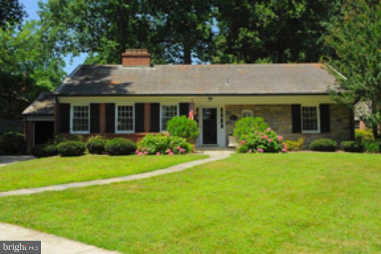 5807 Overlea Road Bethesda, MD 20816 - Photo 1 of 23 a front view of house with yard and green space