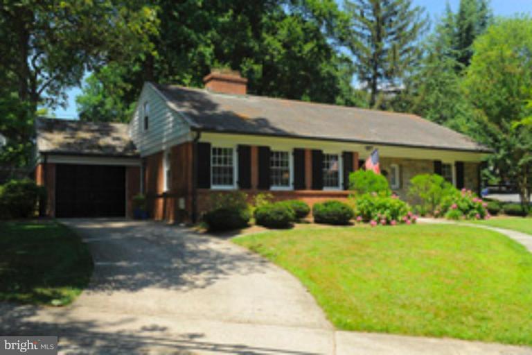 5807 Overlea Road Bethesda, MD 20816 - Photo 2 of 23 a front view of a house with garden