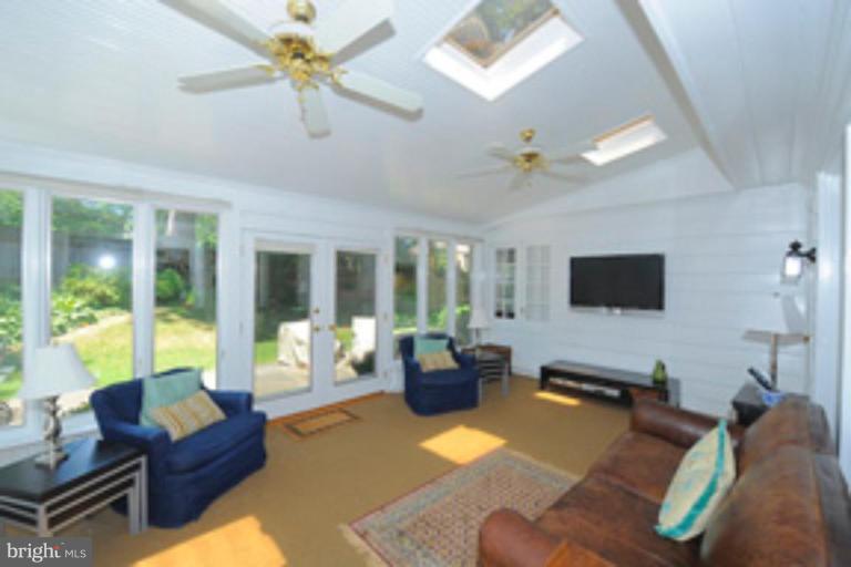 5807 Overlea Road Bethesda, MD 20816 - Photo 11 of 23 a living room with furniture and a flat screen tv