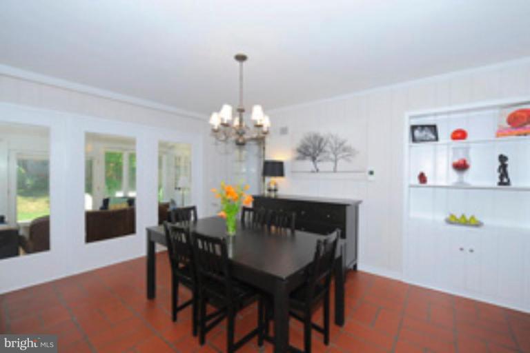 5807 Overlea Road Bethesda, MD 20816 - Photo 6 of 23 a view of a dining room with furniture and chandelier