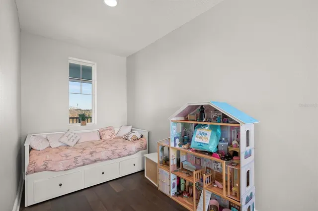 a bedroom with bed and a window