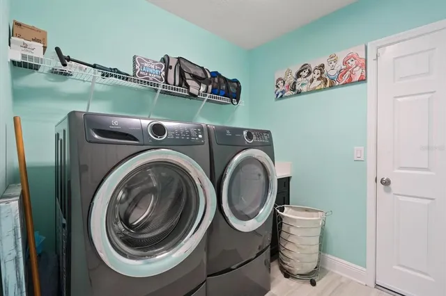 a utility room with dryer and washer