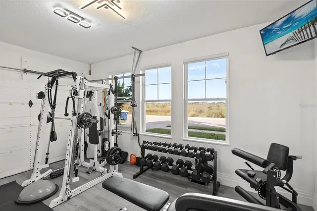 a bedroom with furniture and a window