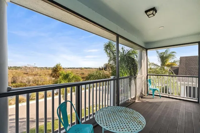 a view of balcony with furniture