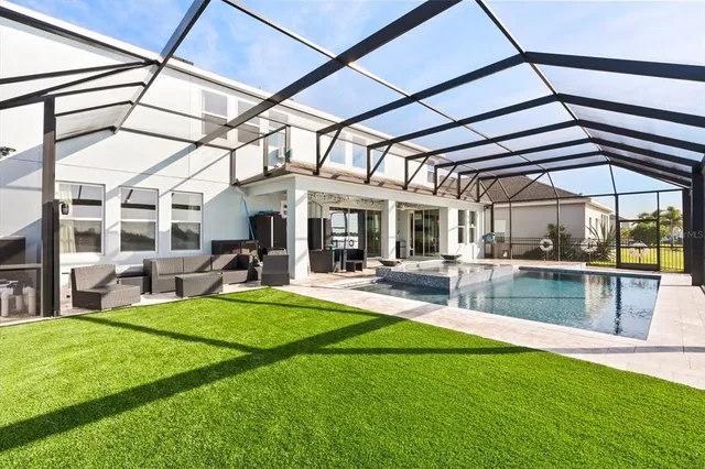 a view of a swimming pool with a patio