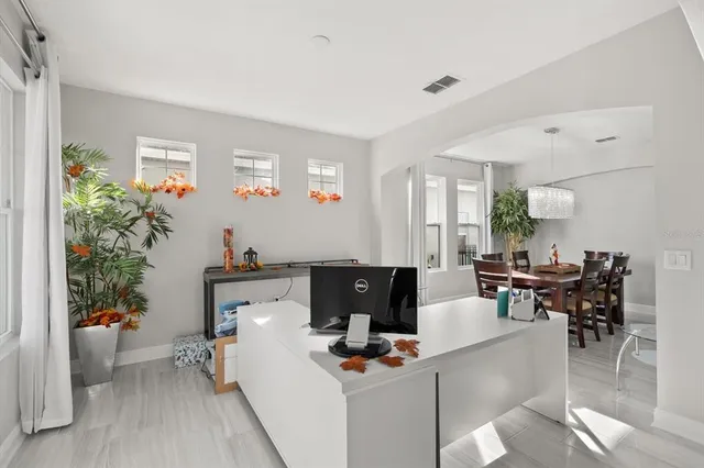 a living room with furniture and a table