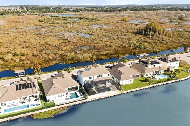 an aerial view of residential houses with outdoor space