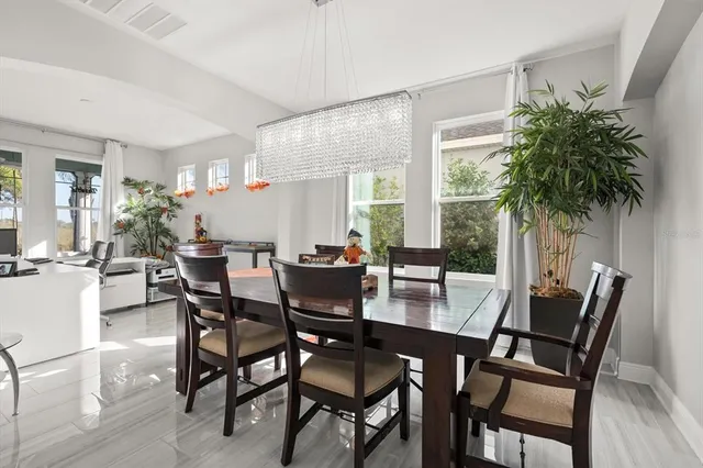 a dining room with furniture and window
