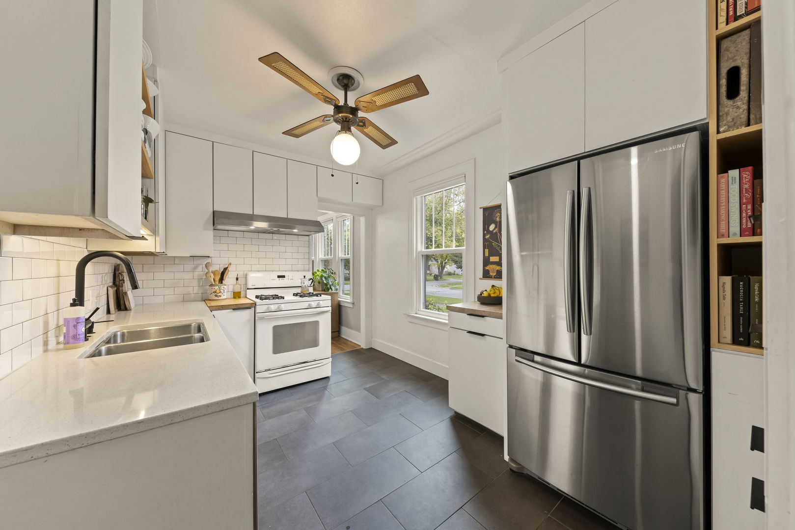1837 Pine Road Homewood, IL 60430 - Photo 12 of 25 a kitchen with stainless steel appliances a refrigerator sink and cabinets