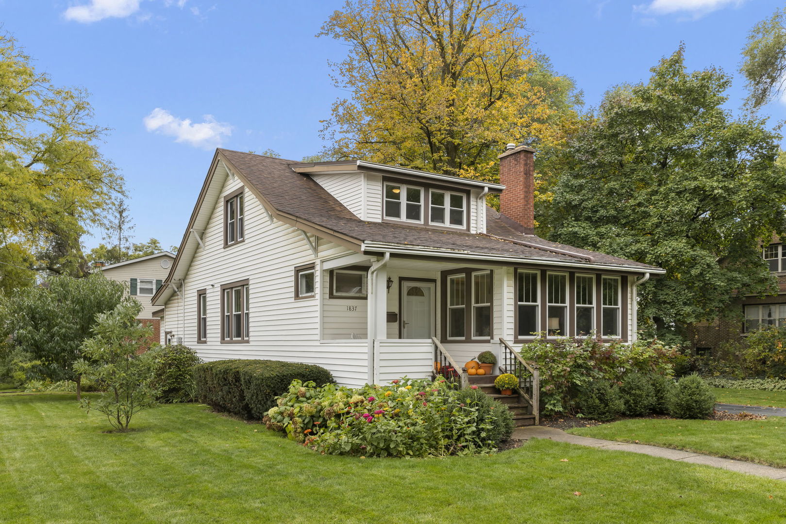 1837 Pine Road Homewood, IL 60430 - Photo 24 of 25 a front view of a house with a garden and plants