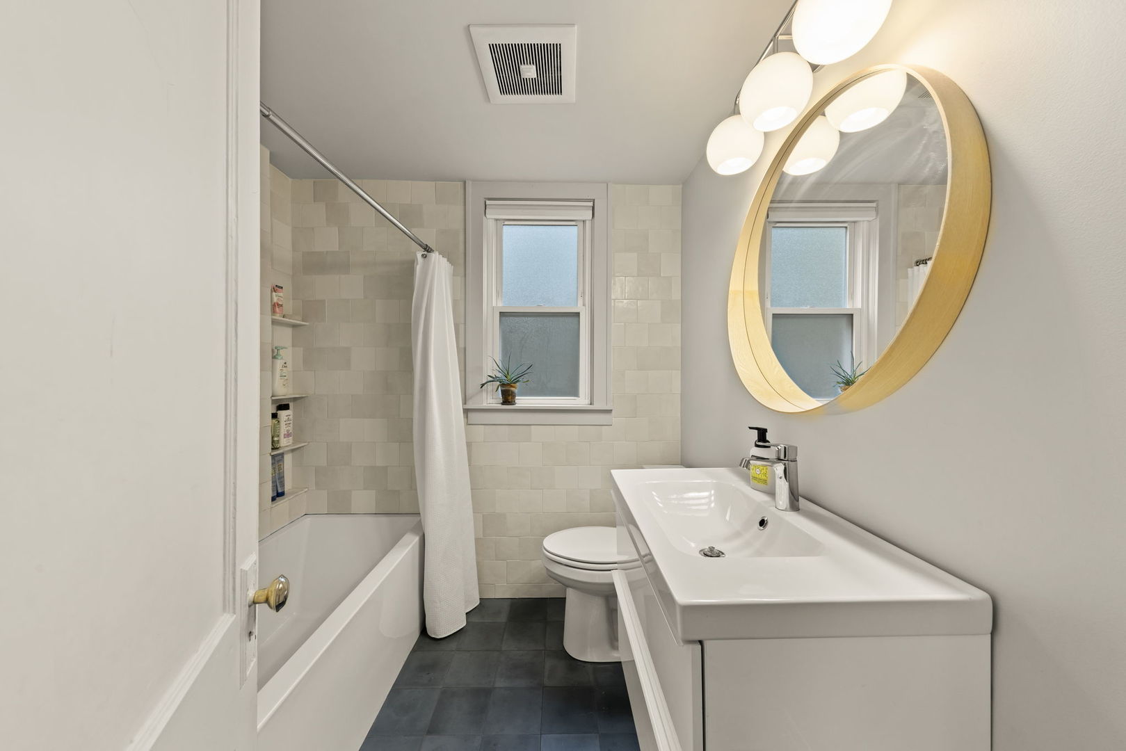1837 Pine Road Homewood, IL 60430 - Photo 8 of 25 a bathroom with a sink a toilet and a mirror