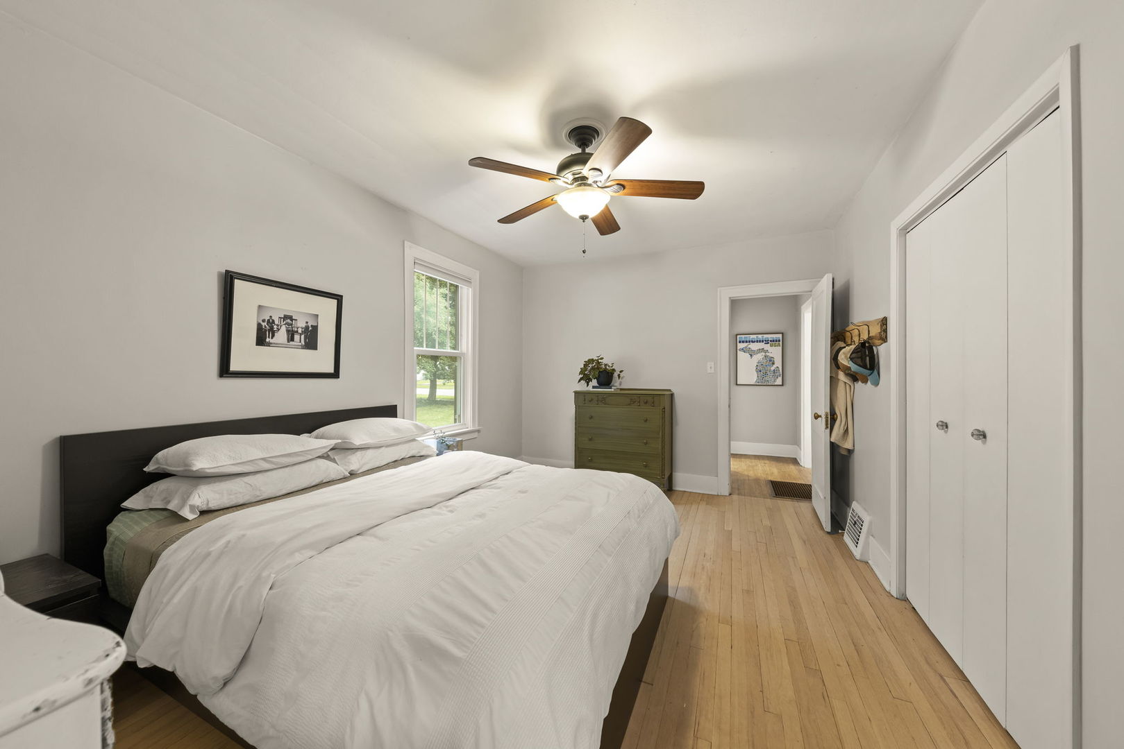 1837 Pine Road Homewood, IL 60430 - Photo 10 of 25 a spacious bedroom with a bed and a chandelier