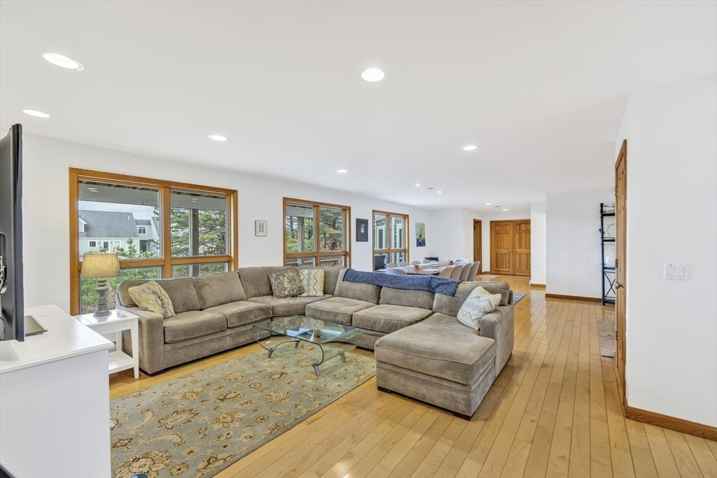 128 Shore Road Truro, MA 02666 - Photo 11 of 42 a living room with furniture and a large window