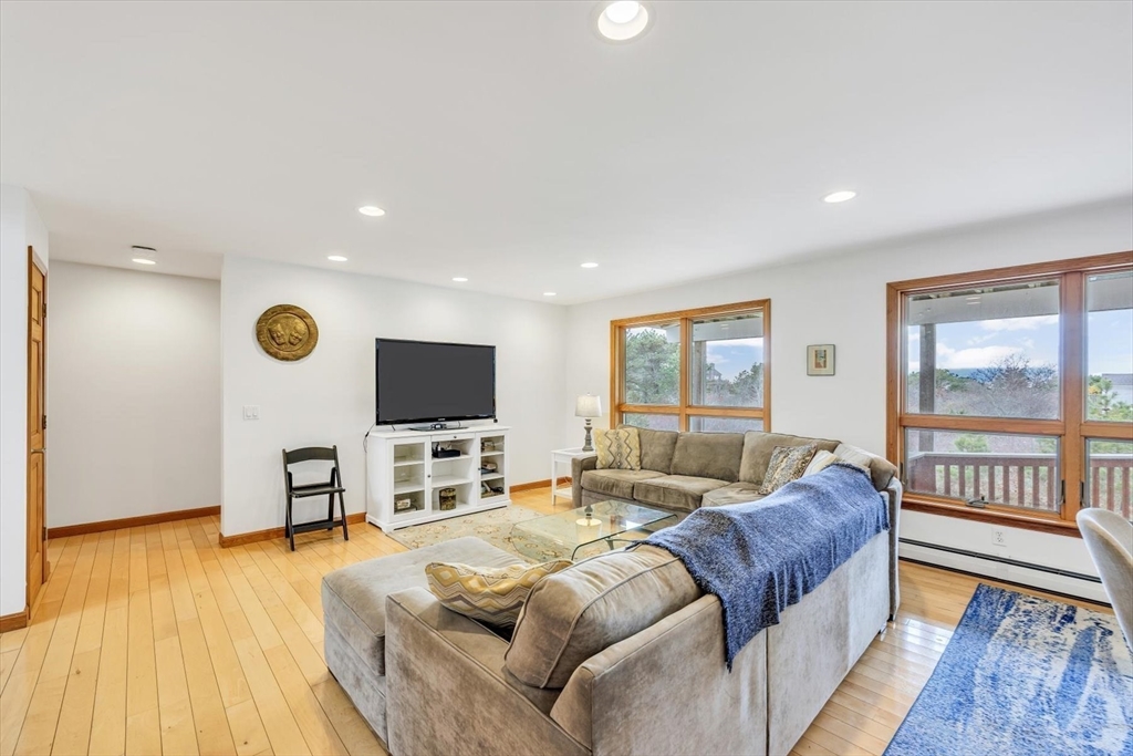 128 Shore Road Truro, MA 02666 - Photo 13 of 42 a living room with furniture and a flat screen tv