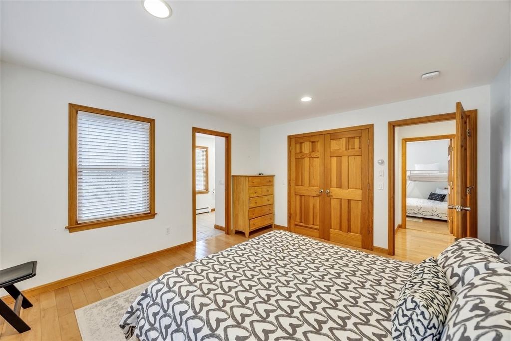 128 Shore Road Truro, MA 02666 - Photo 15 of 42 a bedroom with a bed and a dresser