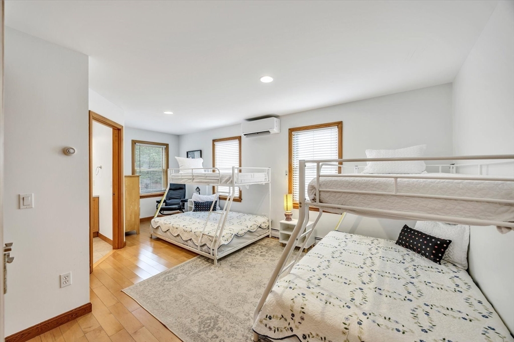 128 Shore Road Truro, MA 02666 - Photo 17 of 42 a bedroom with two beds and painted walls