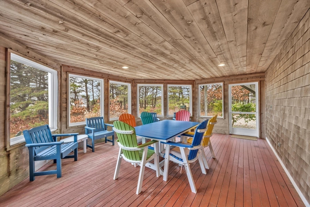 128 Shore Road Truro, MA 02666 - Photo 20 of 42 a dining room with furniture window wooden floor