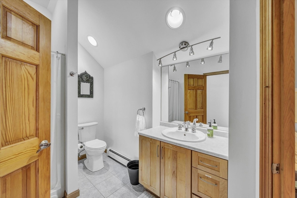 128 Shore Road Truro, MA 02666 - Photo 26 of 42 a bathroom with a sink a toilet and shower a mirror
