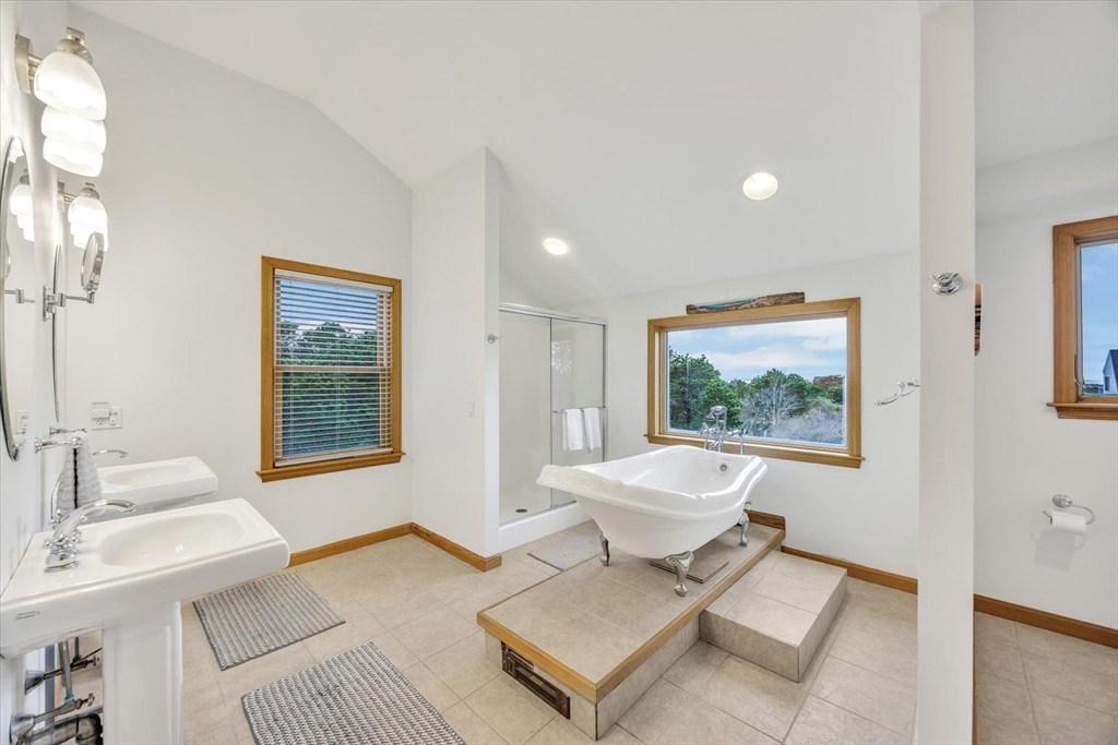 128 Shore Road Truro, MA 02666 - Photo 3 of 42 a living room with a couch and a table