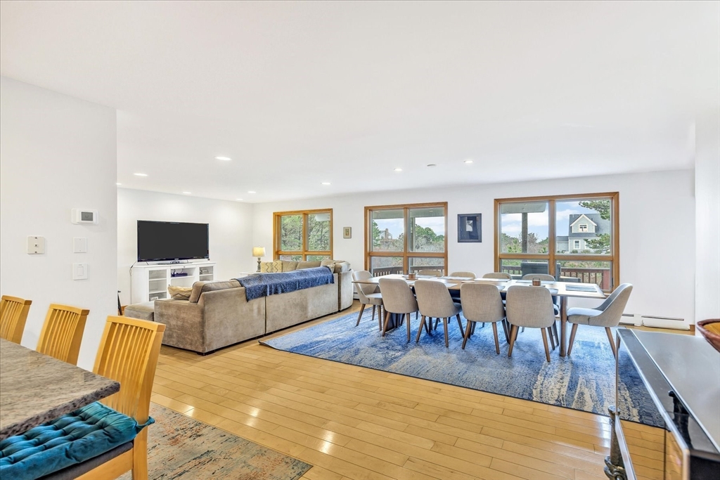 128 Shore Road Truro, MA 02666 - Photo 9 of 42 a living room with lots of furniture and a flat screen tv