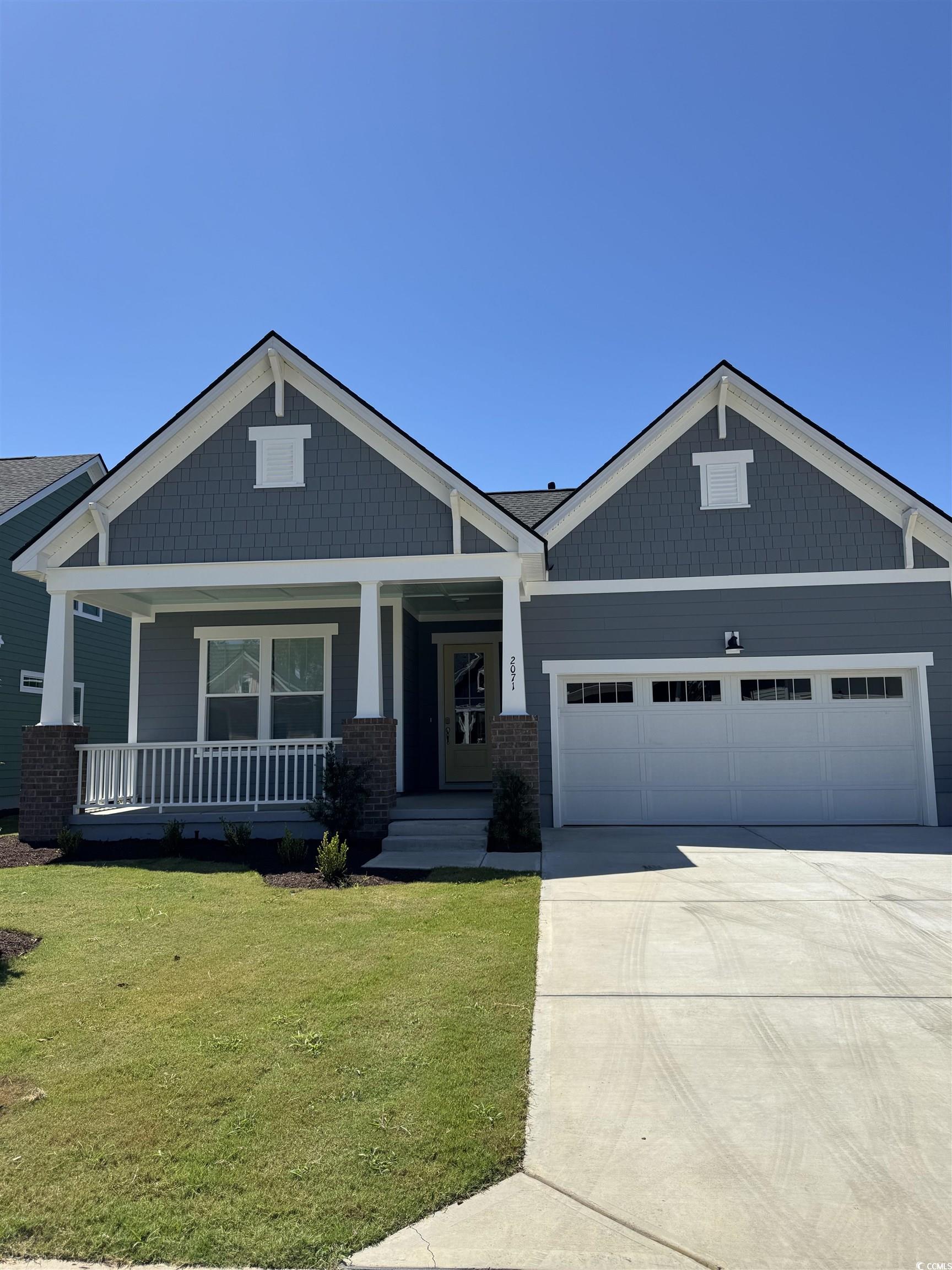 2071 Comradery Way Murrells Inlet, SC 29576 - Photo 1 of 1 Craftsman-style home featuring covered porch, a fr