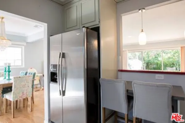 a kitchen with a table and chairs