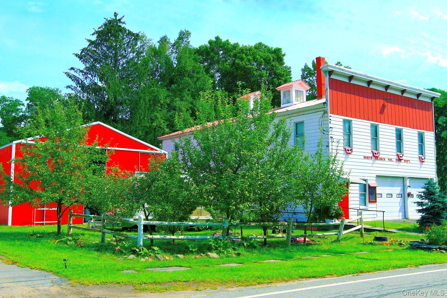 876 North Branch Road North Branch, NY 12766 - Photo 1 of 27 a front view of a house with a yard and trees