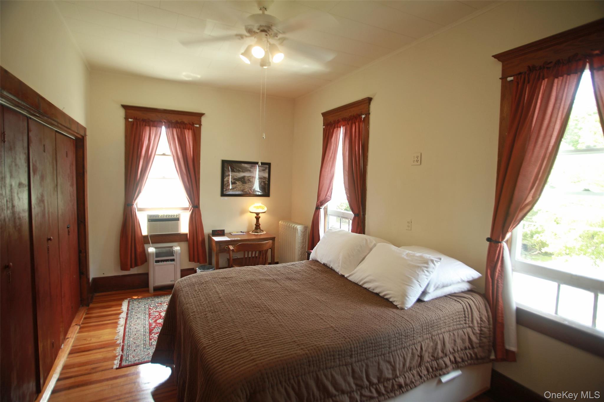 876 North Branch Road North Branch, NY 12766 - Photo 8 of 27 a bedroom with a large bed and a large window