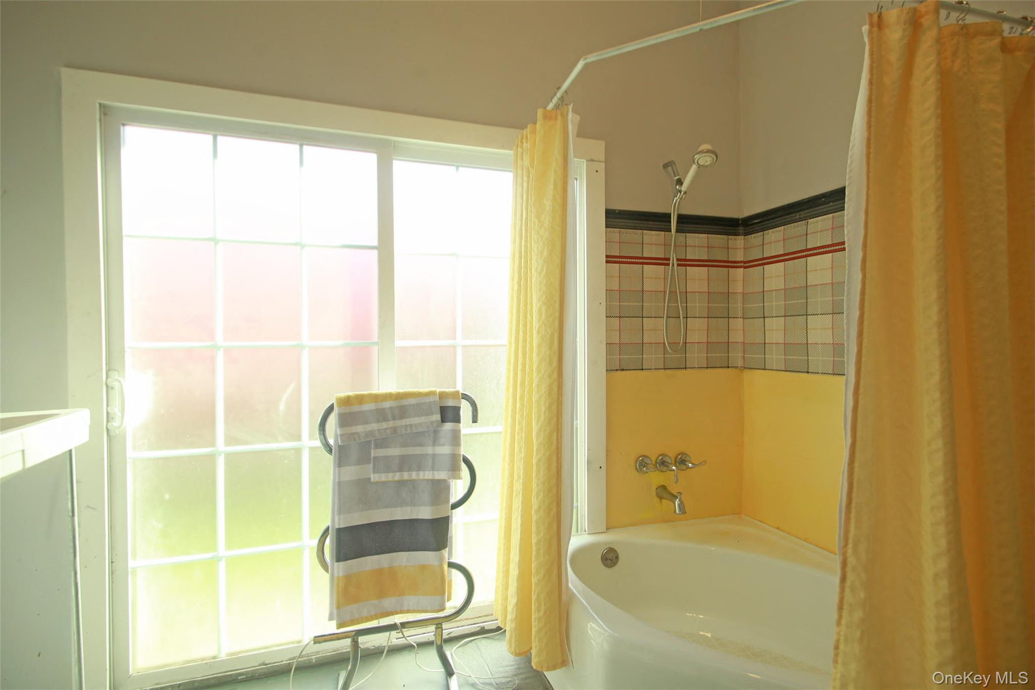 876 North Branch Road North Branch, NY 12766 - Photo 9 of 27 a bathroom with a tub and a shower