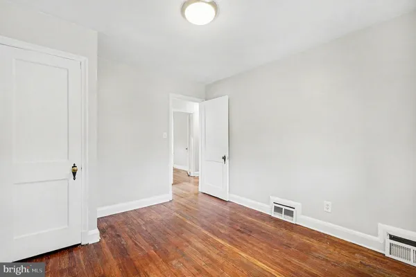 a view of a livingroom with wooden floor