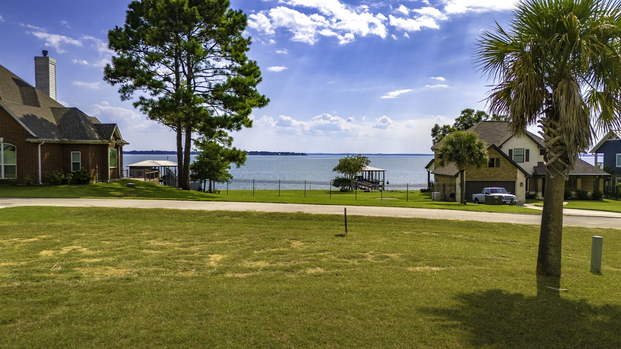 Lot 14 Treasure Point Onalaska, TX 77360 - Photo 3 of 27 a swimming pool with outdoor seating and yard