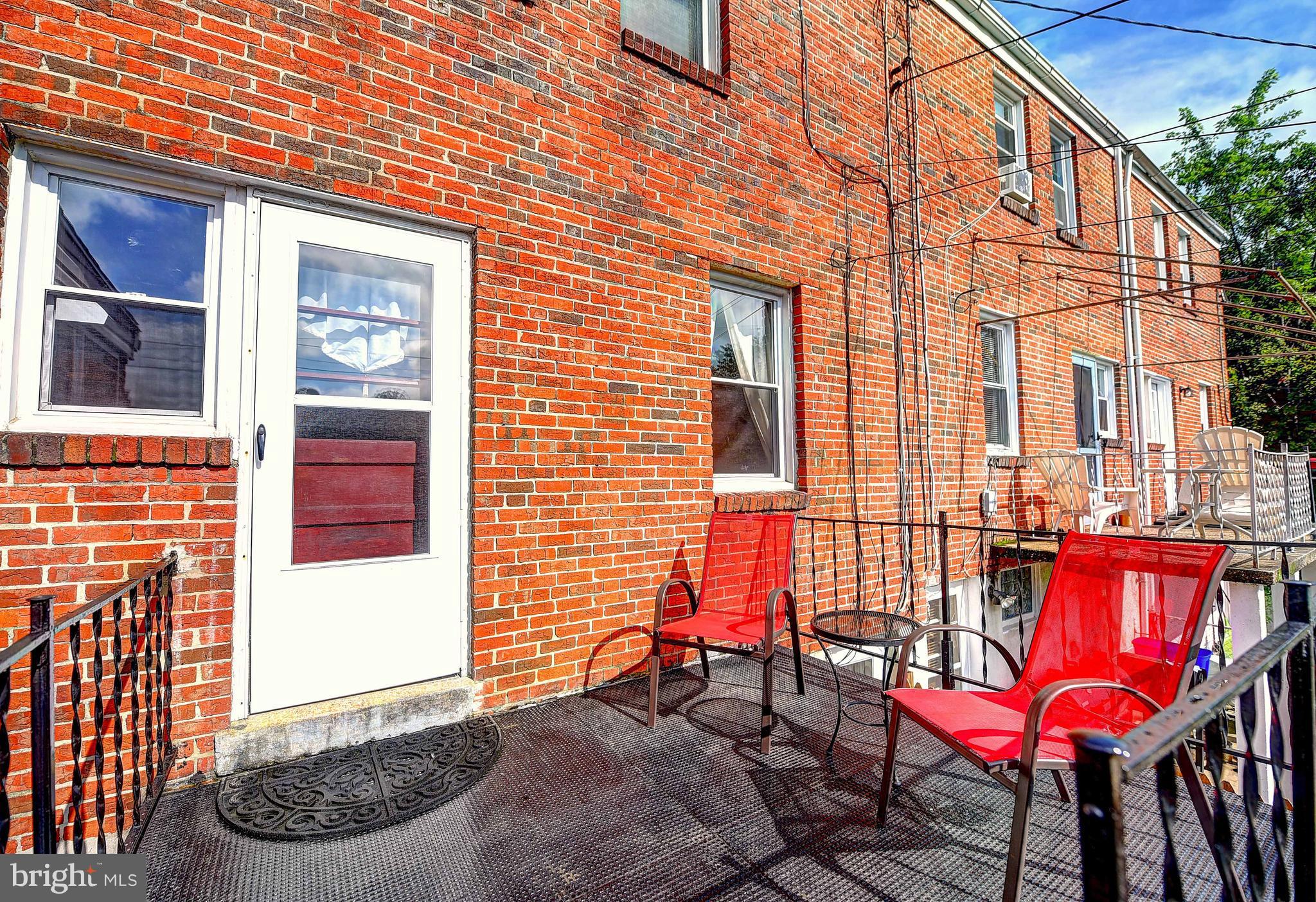 8513 Oak Road Baltimore, MD 21234 - Photo 15 of 17 a view of a chairs with red door
