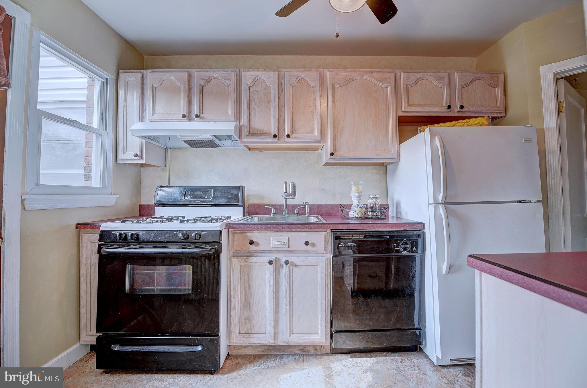 8513 Oak Road Baltimore, MD 21234 - Photo 4 of 17 a kitchen with stainless steel appliances granite countertop a stove and a refrigerator