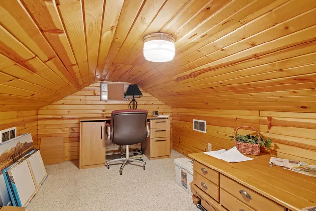 a view of a workspace with furniture