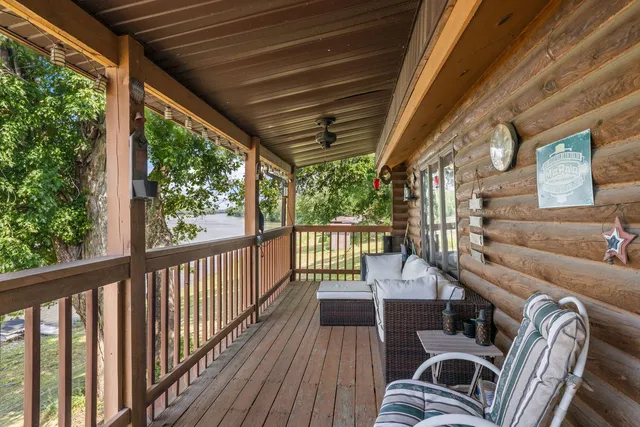 a view of balcony with furniture