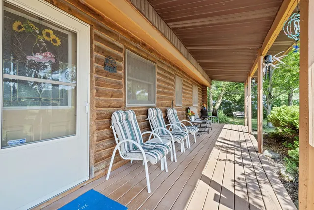 a view of a patio with a table and chairs