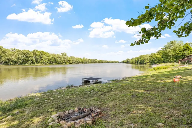 a view of a lake with houses in the back