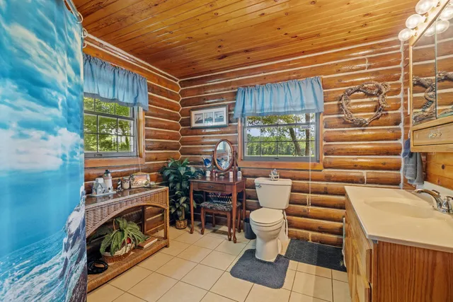 a dining room with furniture and a window