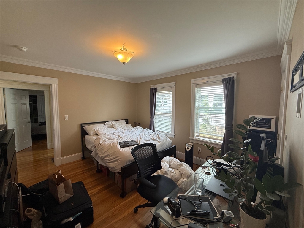 72 Bennett Street, Unit 72 Boston, MA 02135 - Photo 10 of 17 a bedroom with furniture and a window