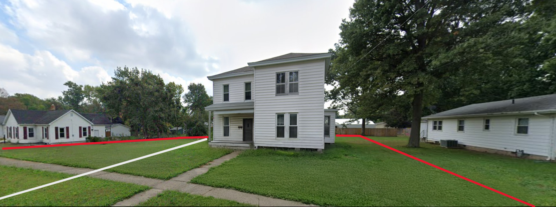 150 East Tanner Street Waverly, IL 62692 - Photo 1 of 5 a view of house with a big yard potted plants and large tree